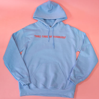 blue hoodie with pink writing