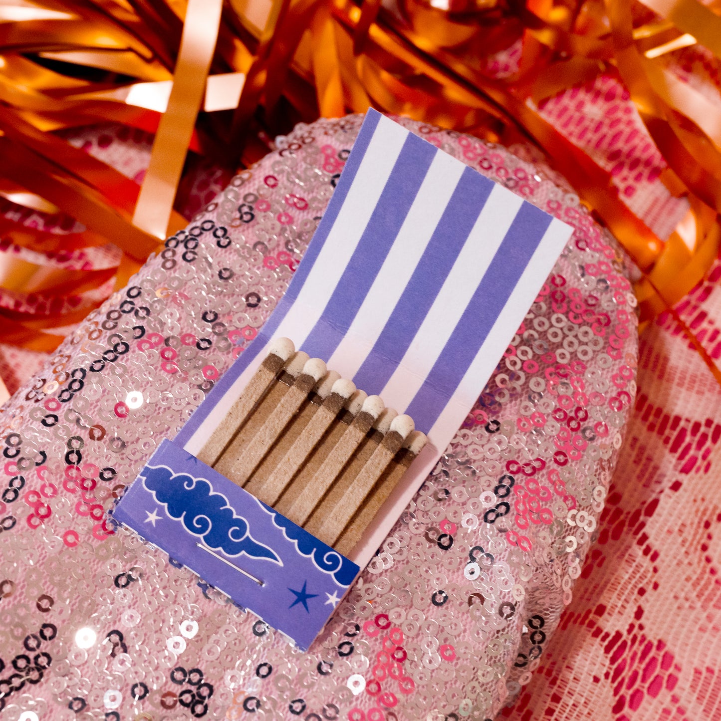 purple and white striped matchbook
