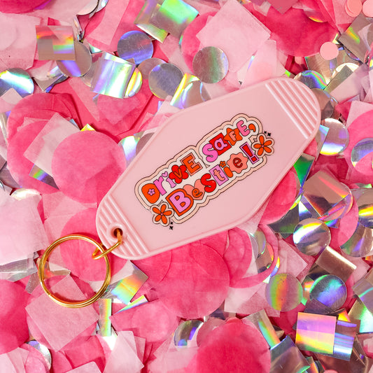 pink motel keychain with colorful words