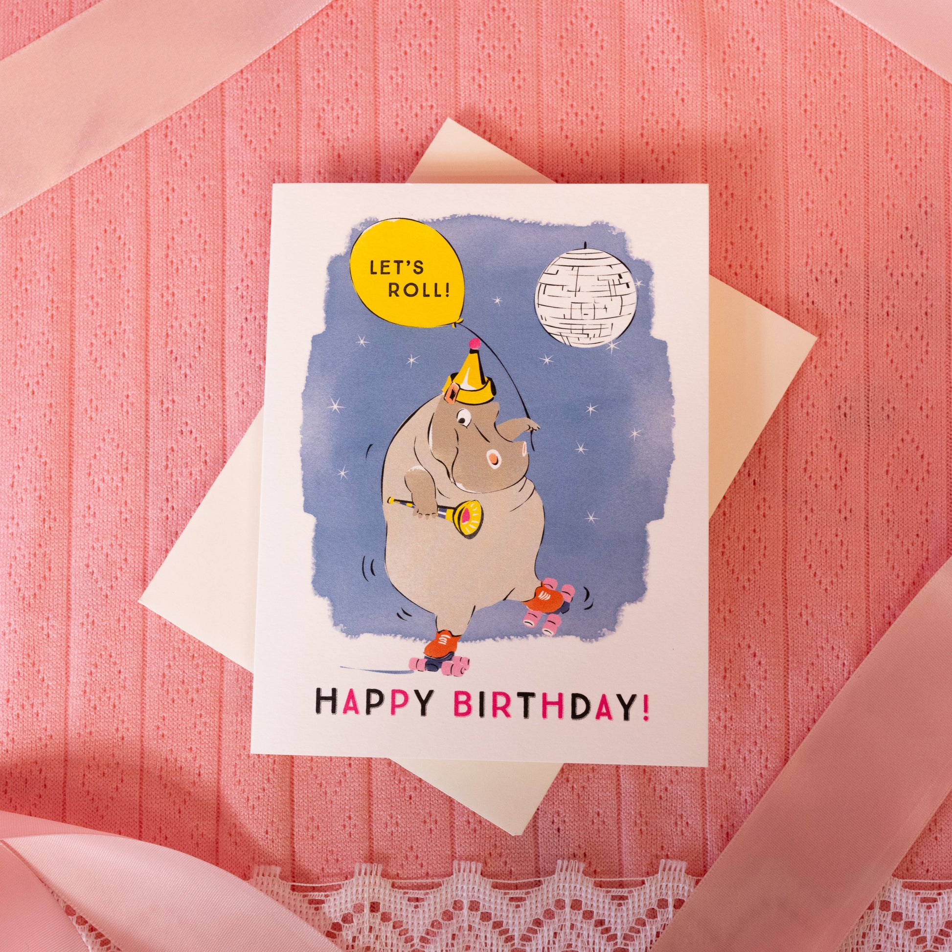 white card with blue background and grey hippo