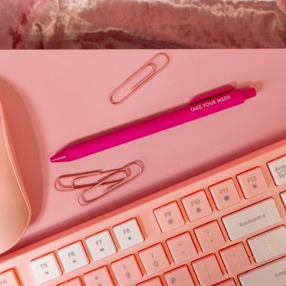 hot pink pen with white words