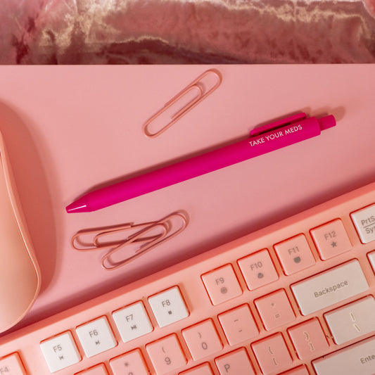 hot pink pen with white words