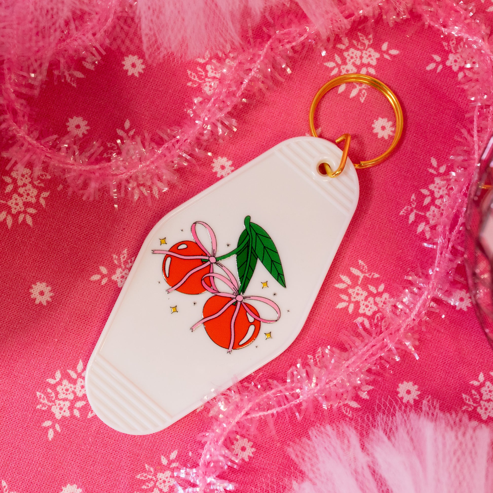 pink bows on red cherries keychain