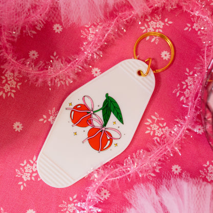 pink bows on red cherries keychain