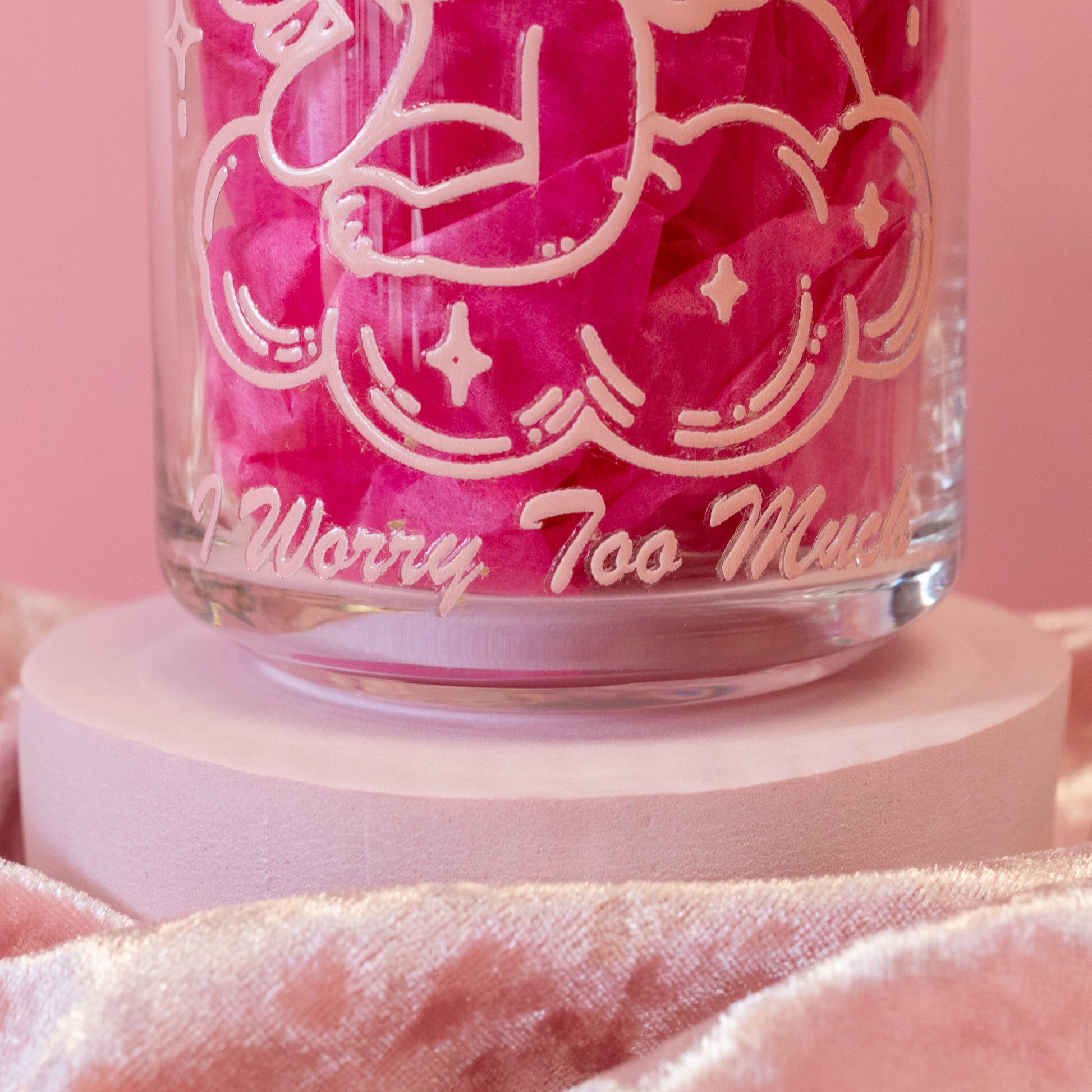 pink cursive lettering on clear glass