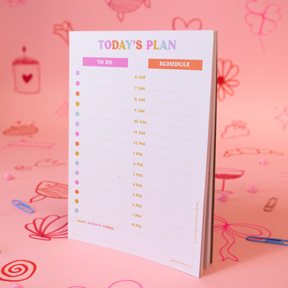 white notepad with times listed and to do list