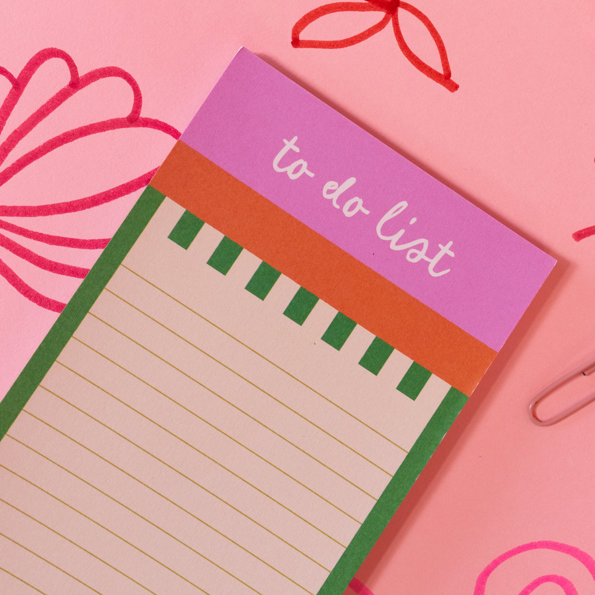 green striped to do list with pink top