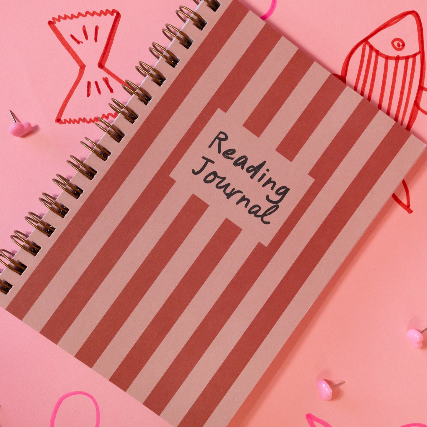 pink and red striped spiral journal