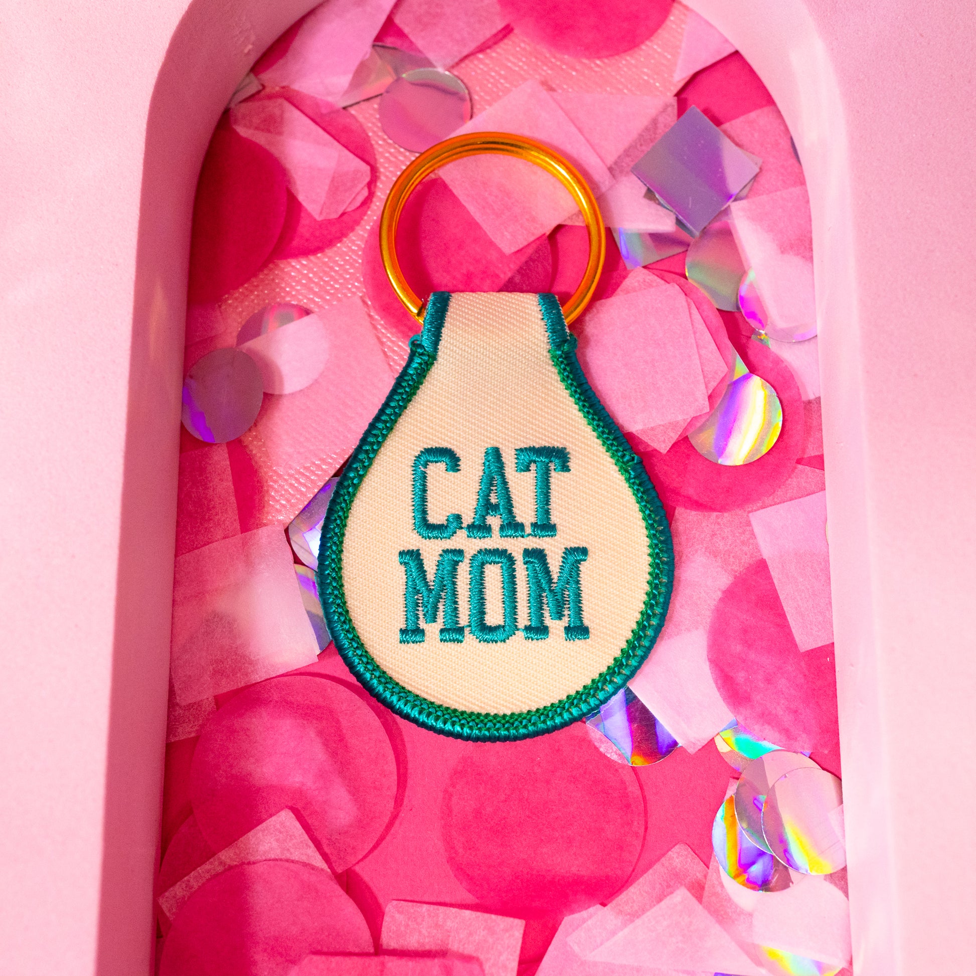 cat mom green and beige keychain