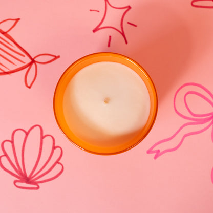 white and orange candle