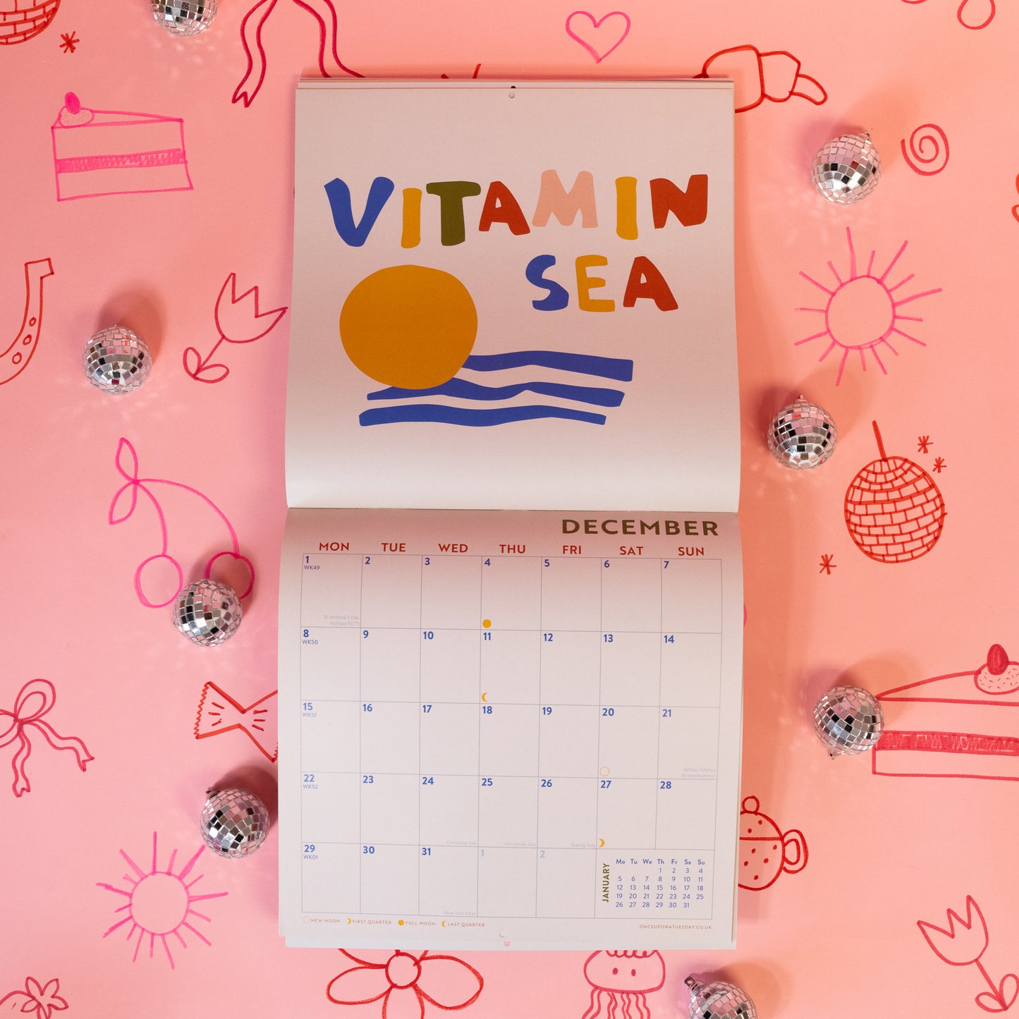 white calendar with red, blue and yellow designs