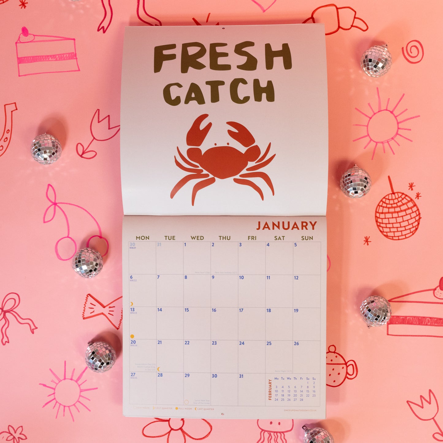 white calendar with red crab