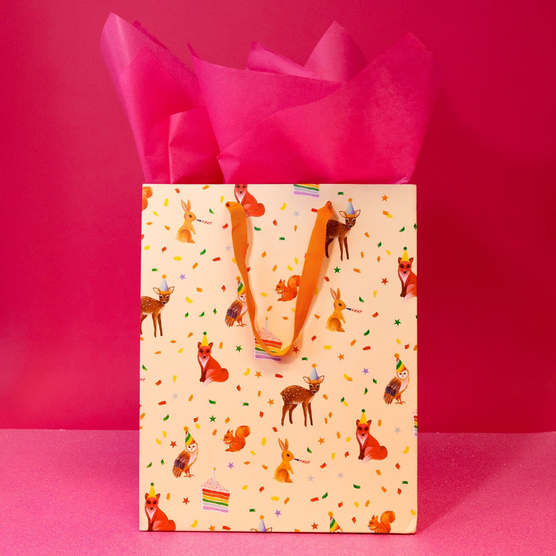 beige bag with animals and confetti