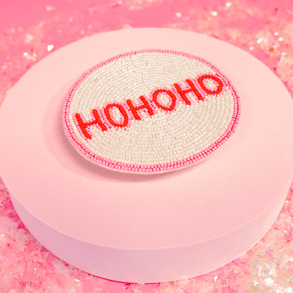 pink and red lettering coaster