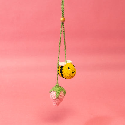 pink strawberry and yellow bee
