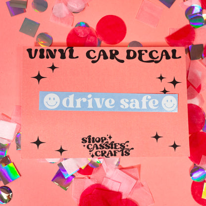 pink background with white drive safe decal