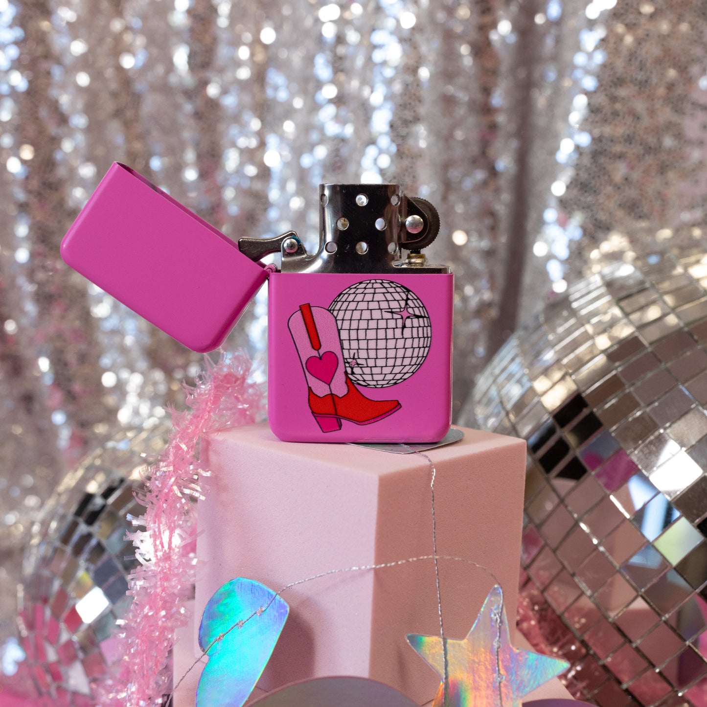 pink boot and silver disco ball lighter