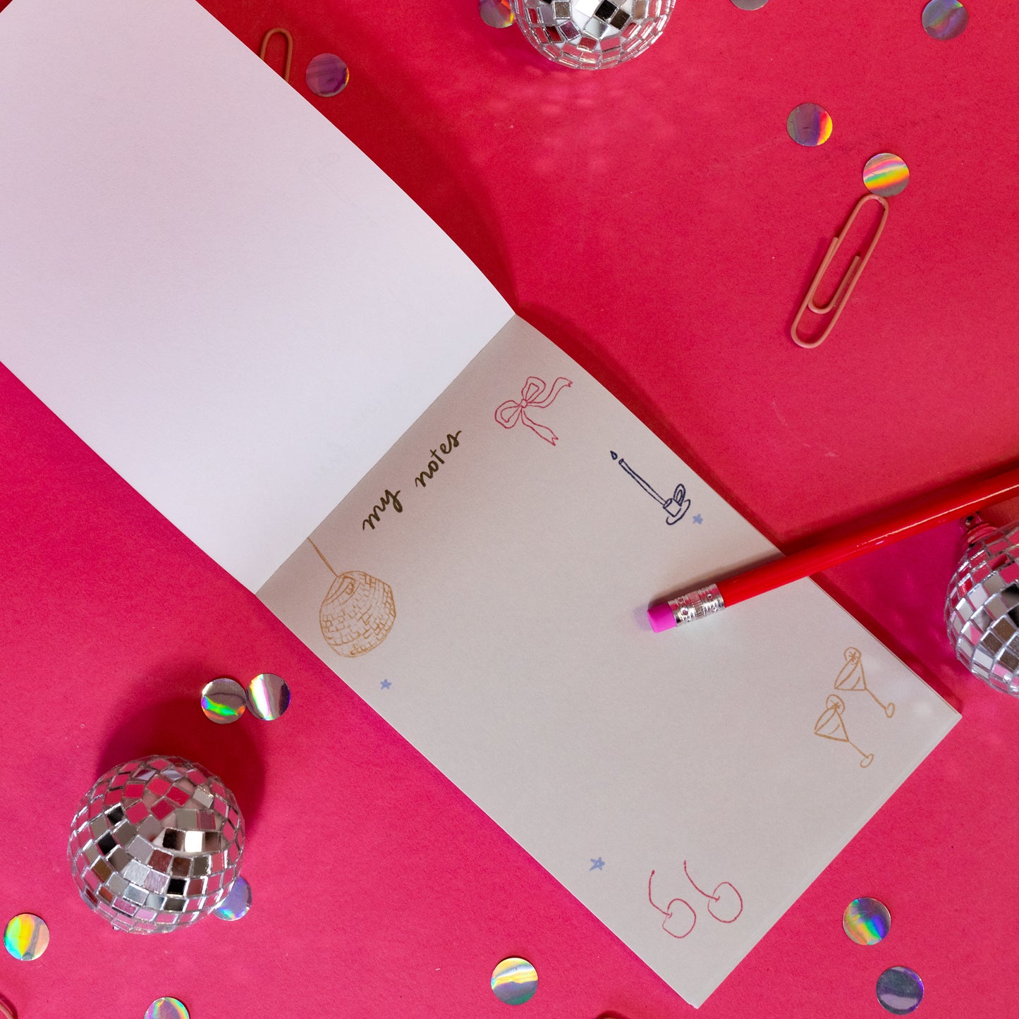 grey notepad with red cherries, cocktail glasses, stars, bows
