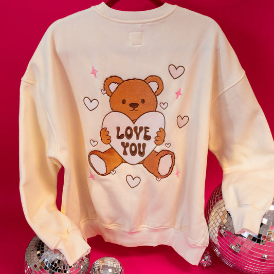 cream sweatshirt with bear