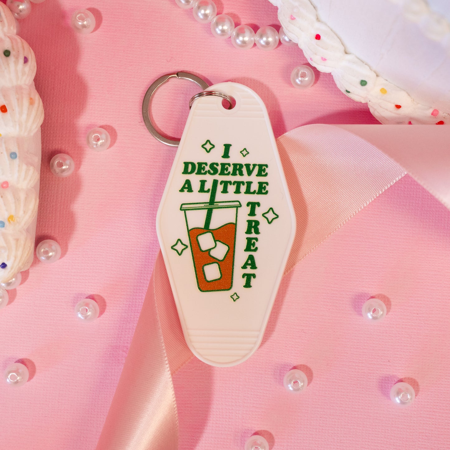 white and green motel keychain