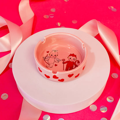 light pink dish decorated with red hearts