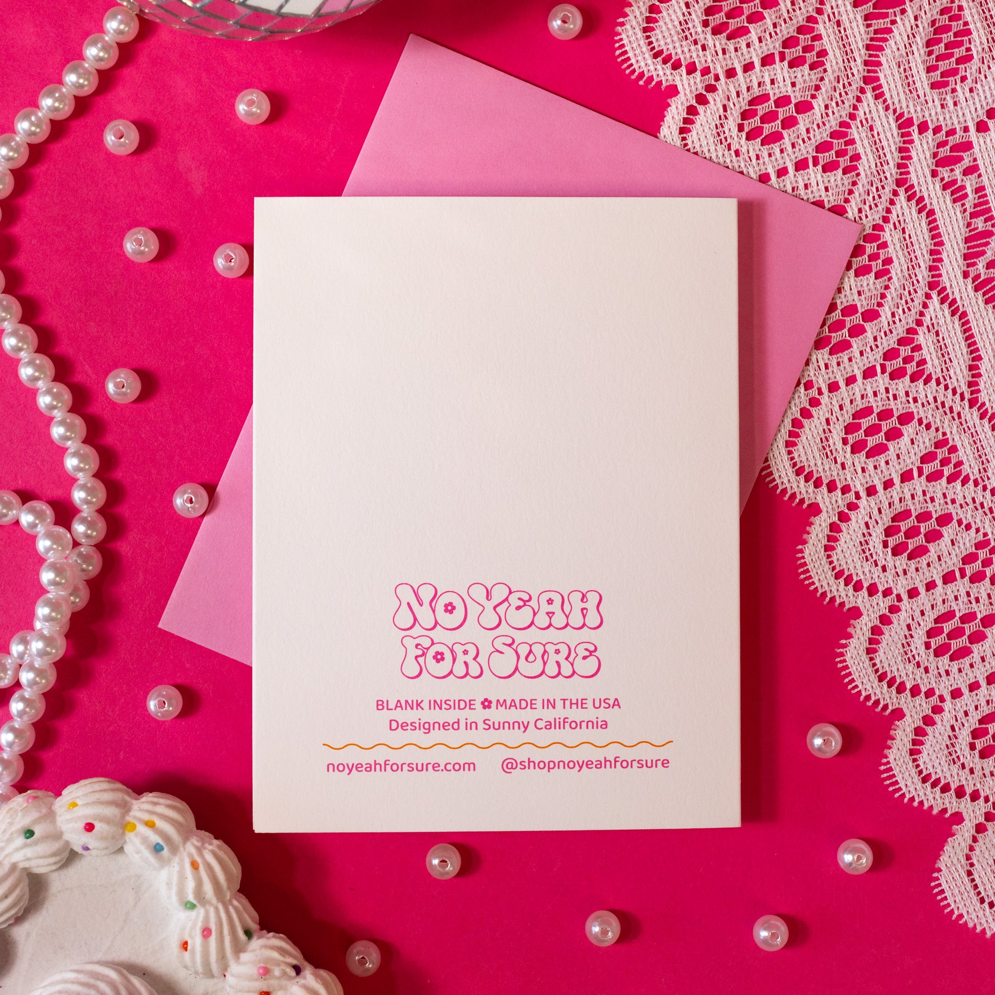 white card with pink words