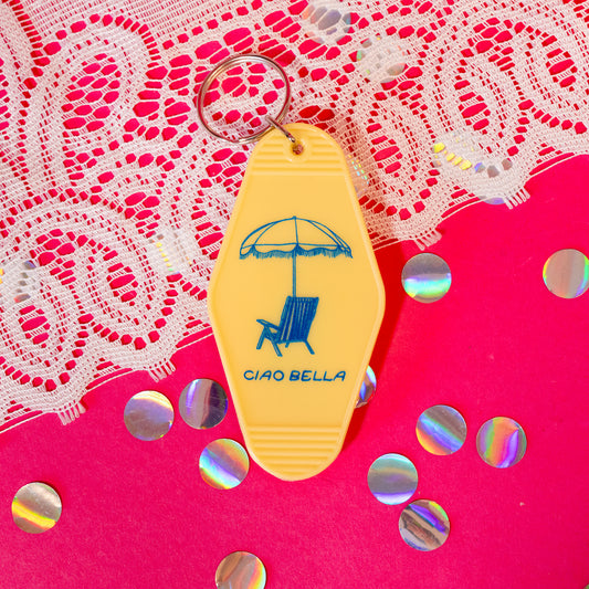 yellow keychain with blue design