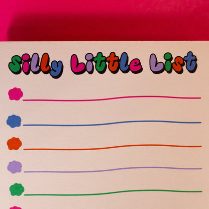 white pad with colorful letters