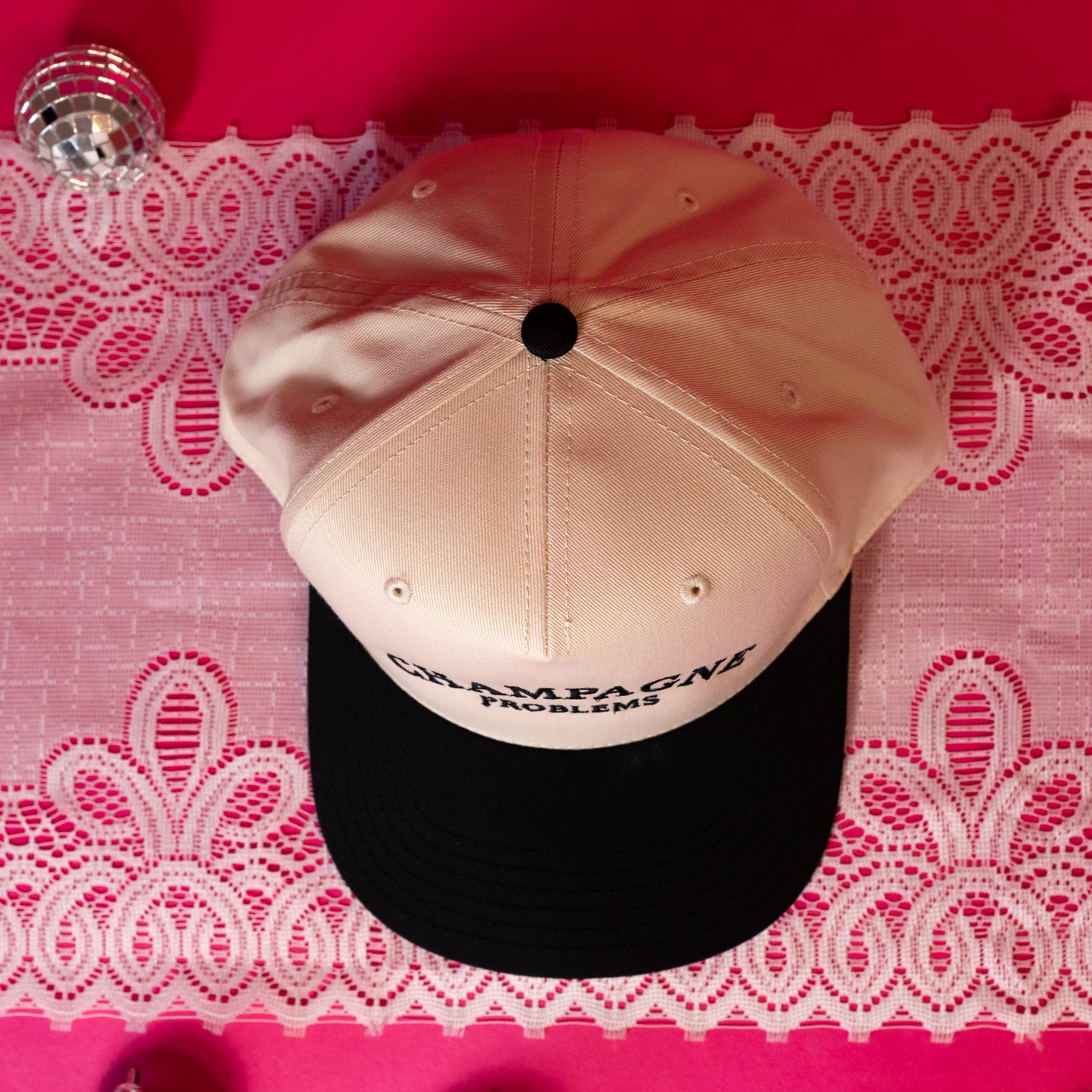beige and black hat