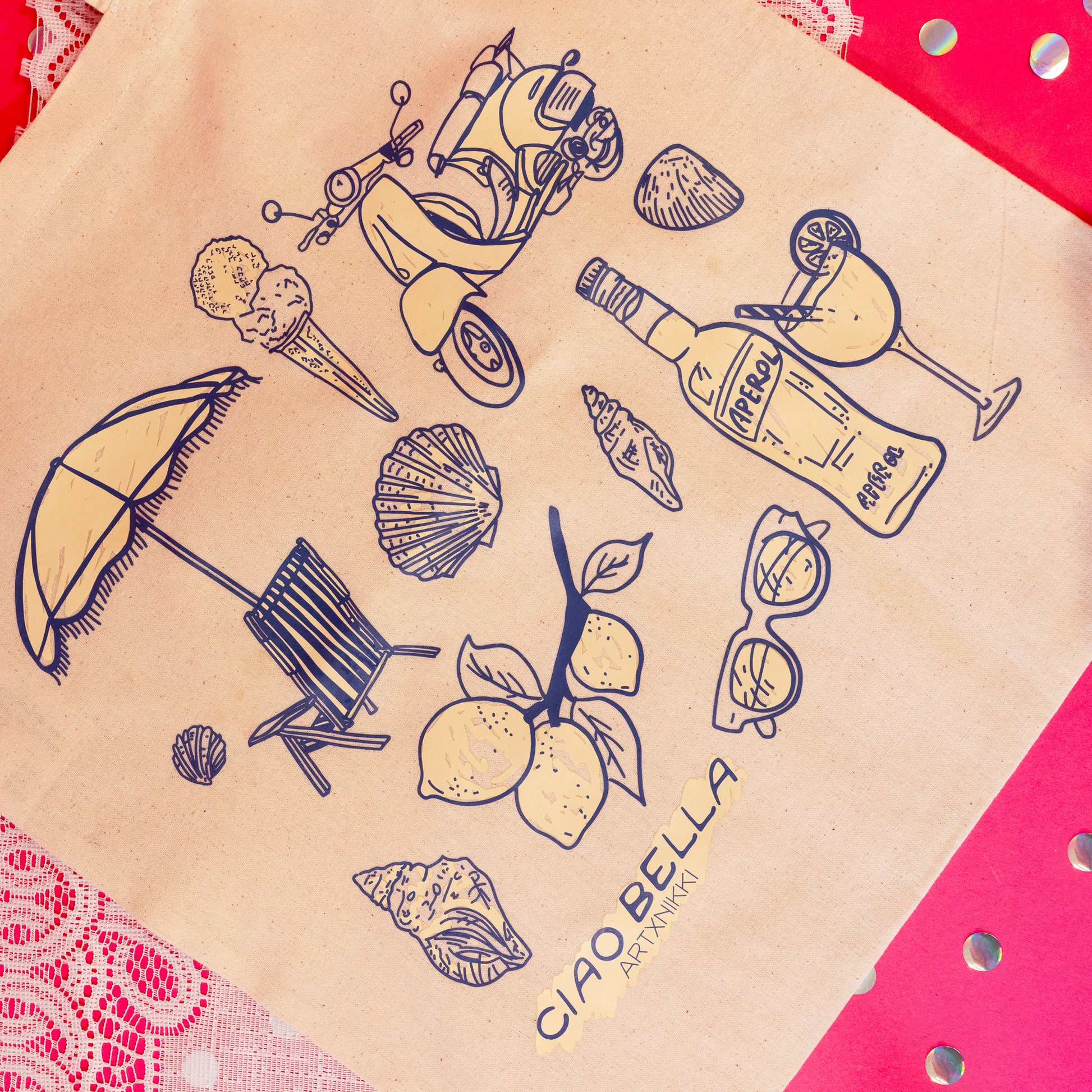 beige tote with lemons, sunglasses, seashells and cocktails