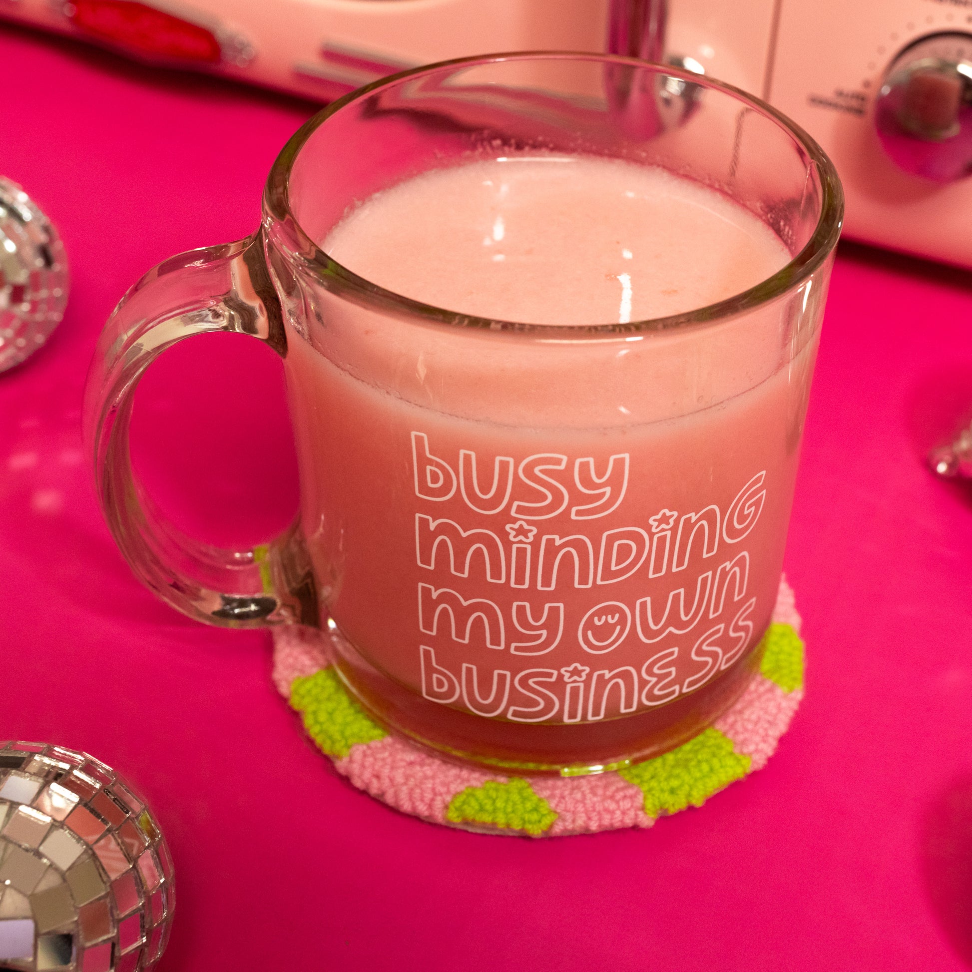 pink liquid in clear mug