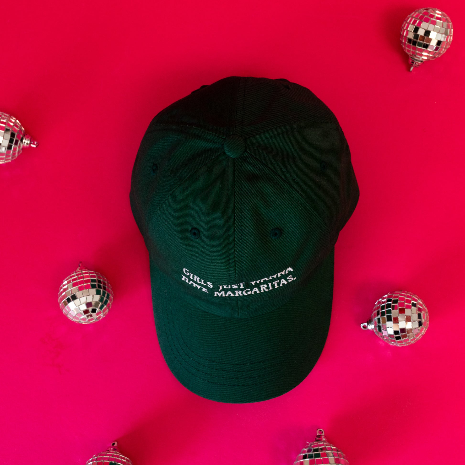 green baseball cap with white words