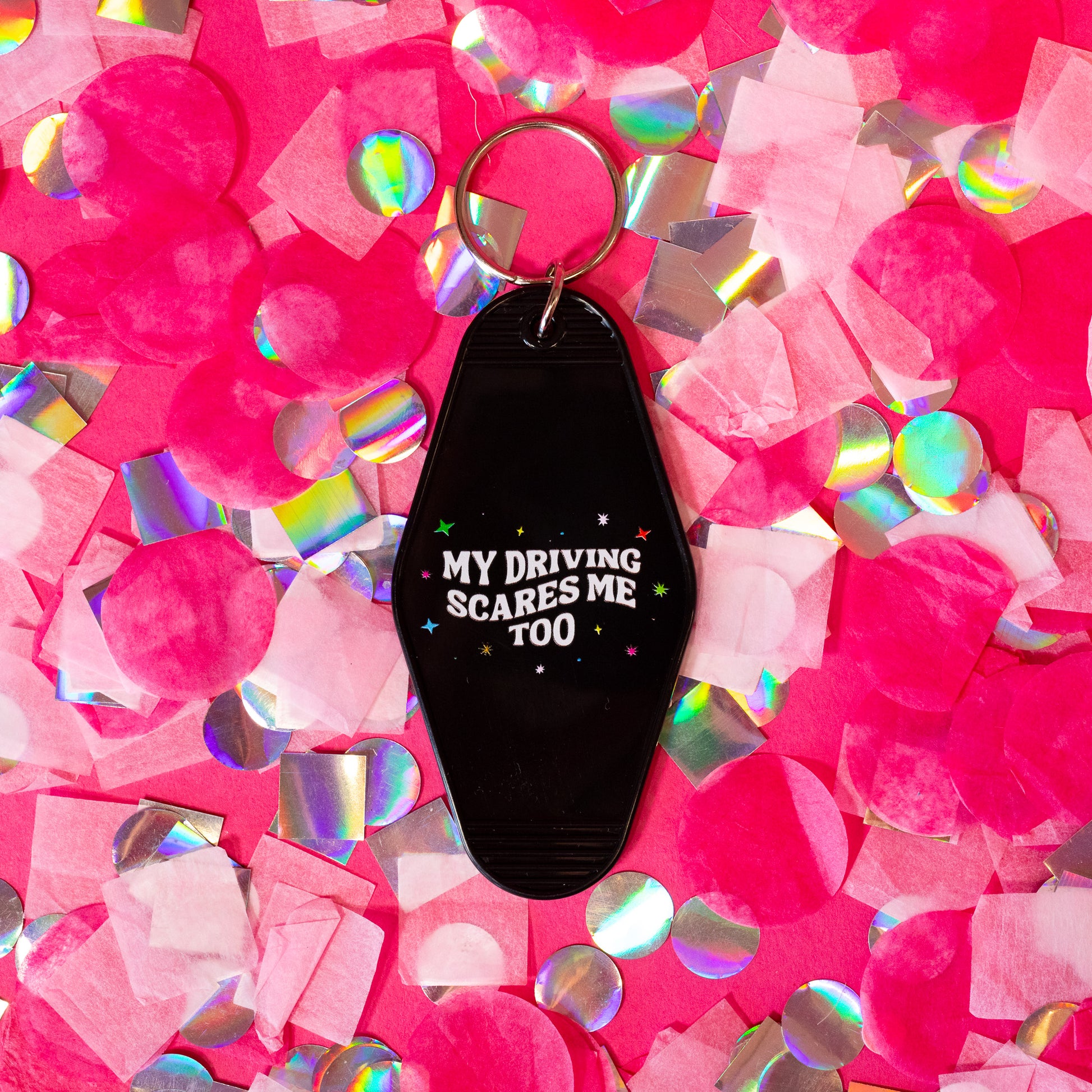 black keychain with white words