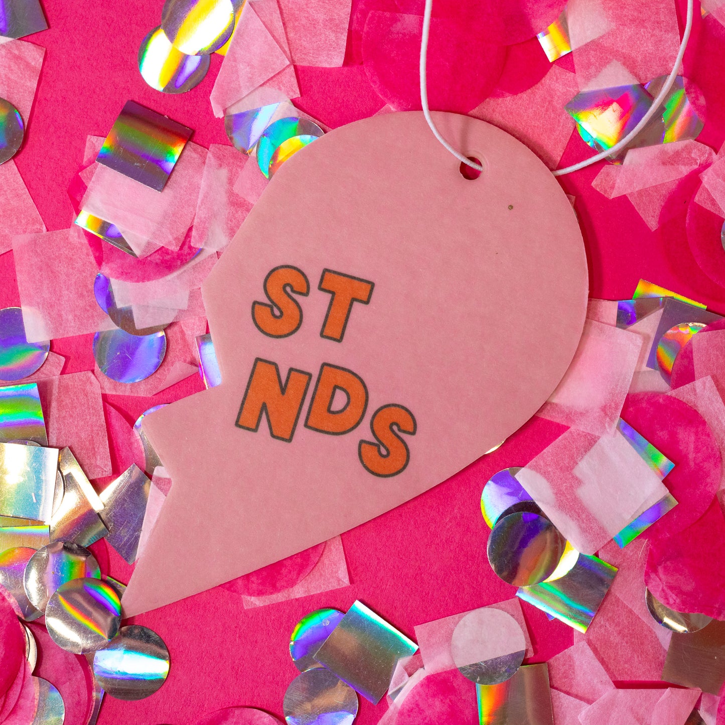 pink half heart air freshener with orange words