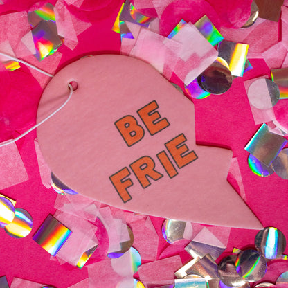 pink half heart air freshener with orange words