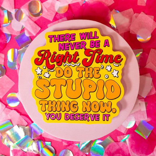 bright yellow sticker with red and pink words