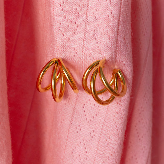 three hoop gold earrings