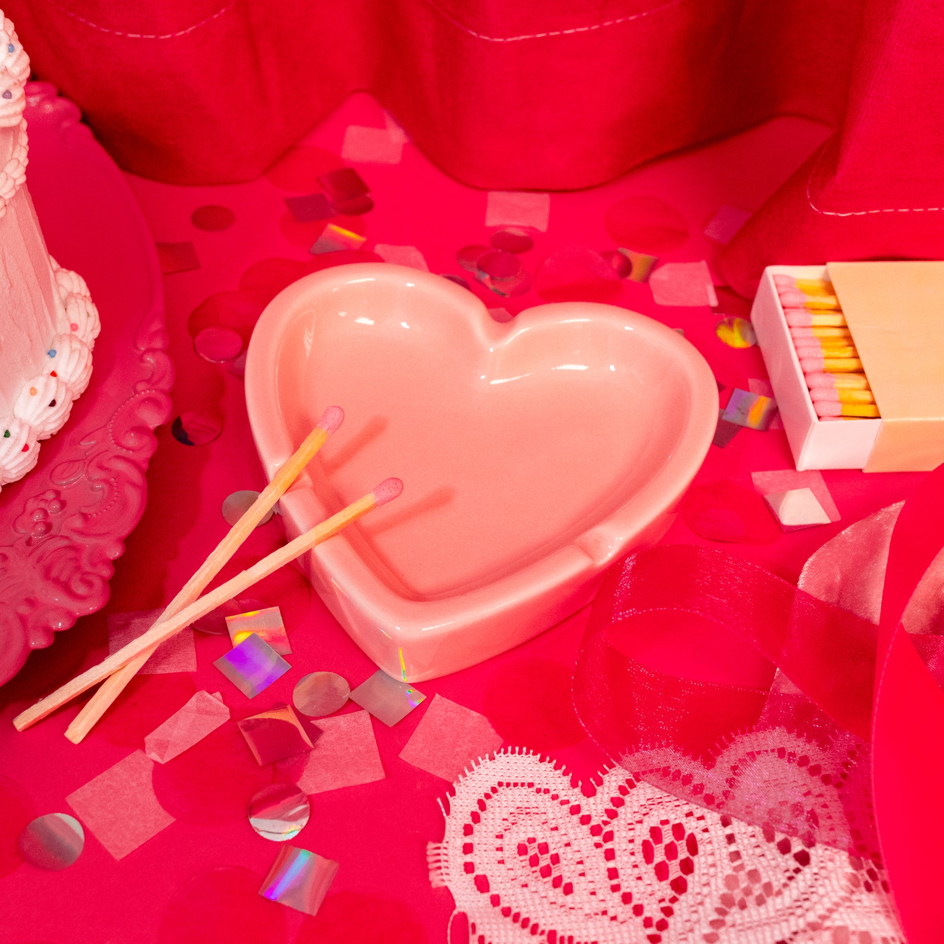 pink heart dish with matches