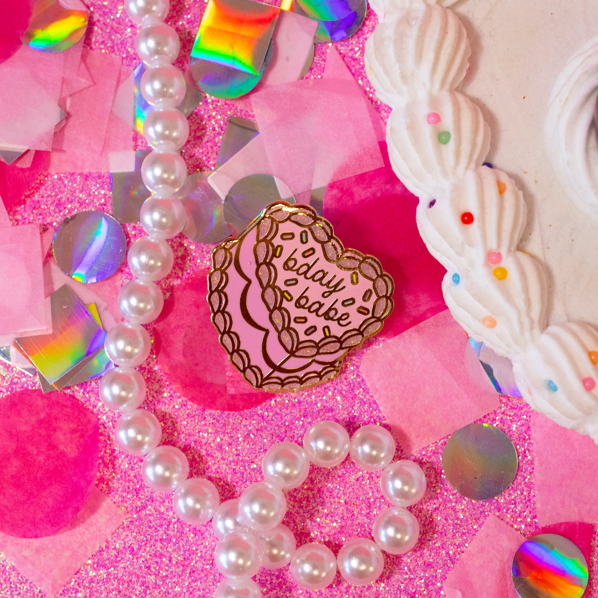 pink cake pin with words