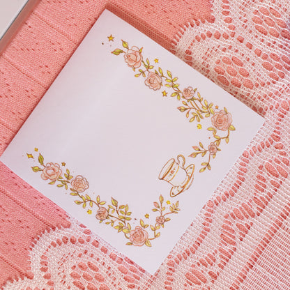 greenery and pink flowers with tea cup