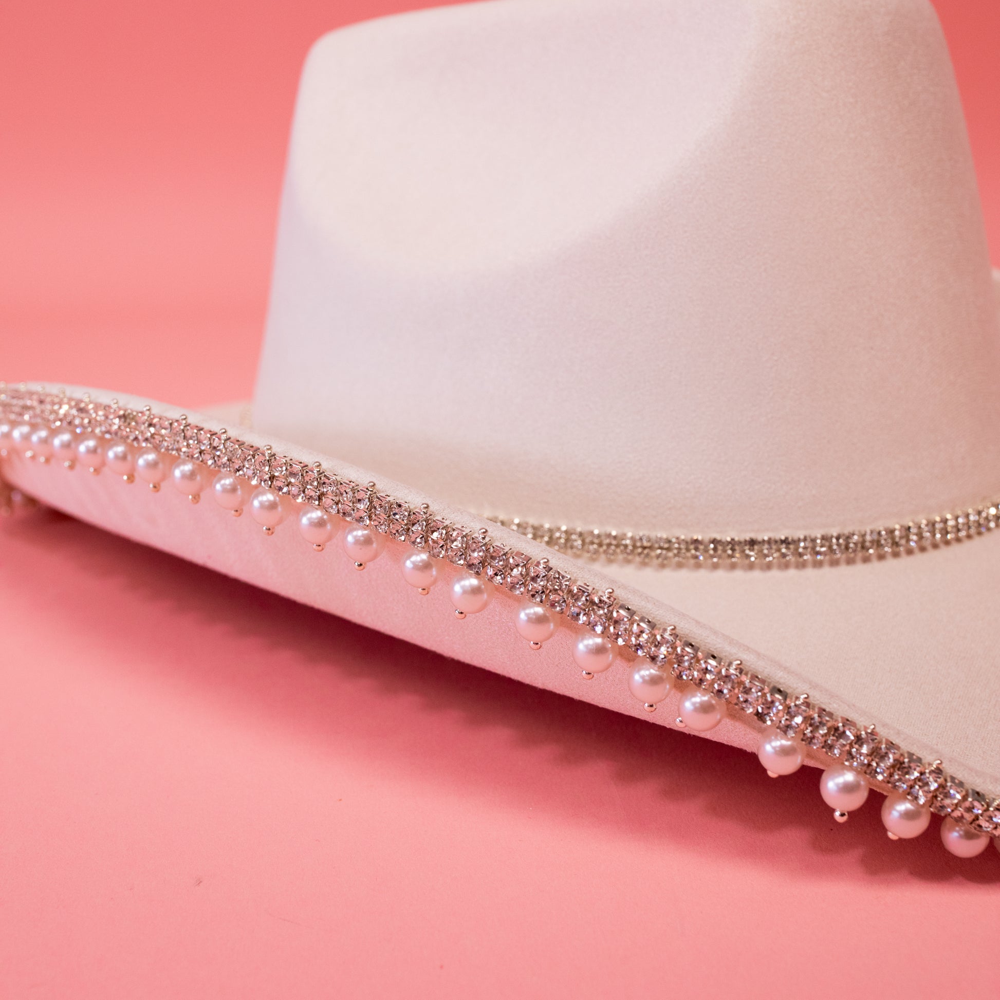 pearl and rhinestone detailing on ivory hat