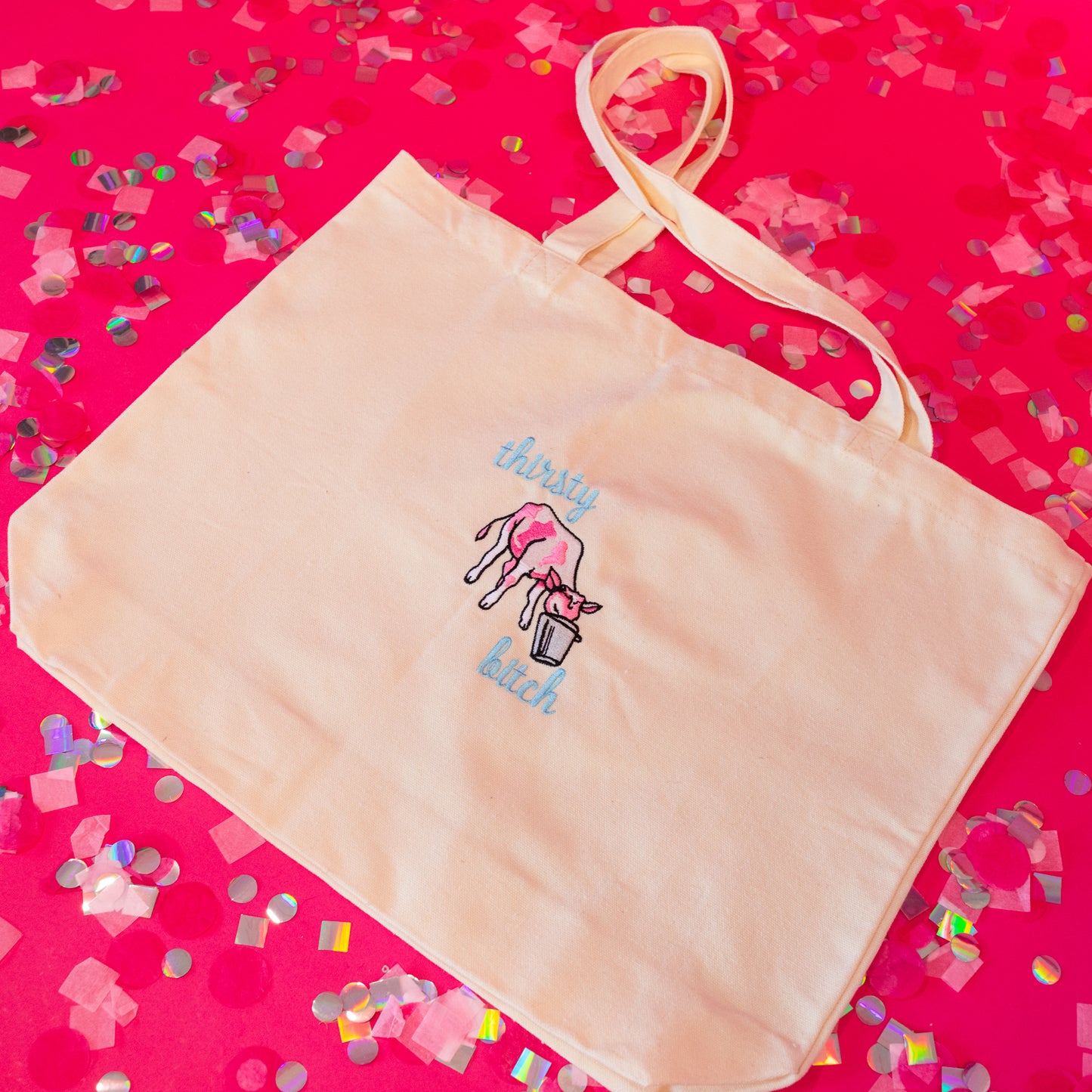 Beige tote with pink and blue embroider