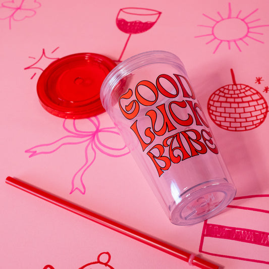 clear tumbler with big red words