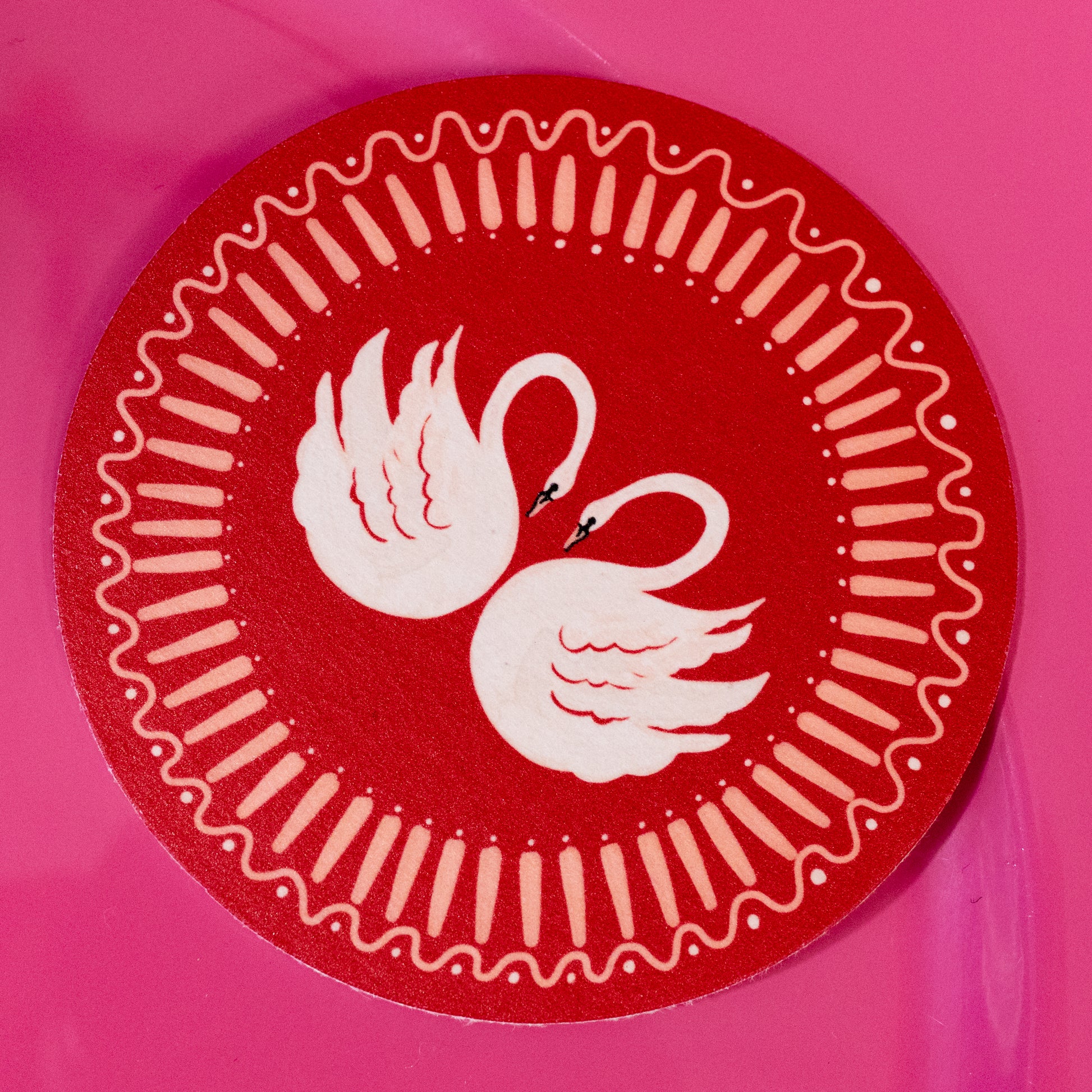 white and red swan coaster