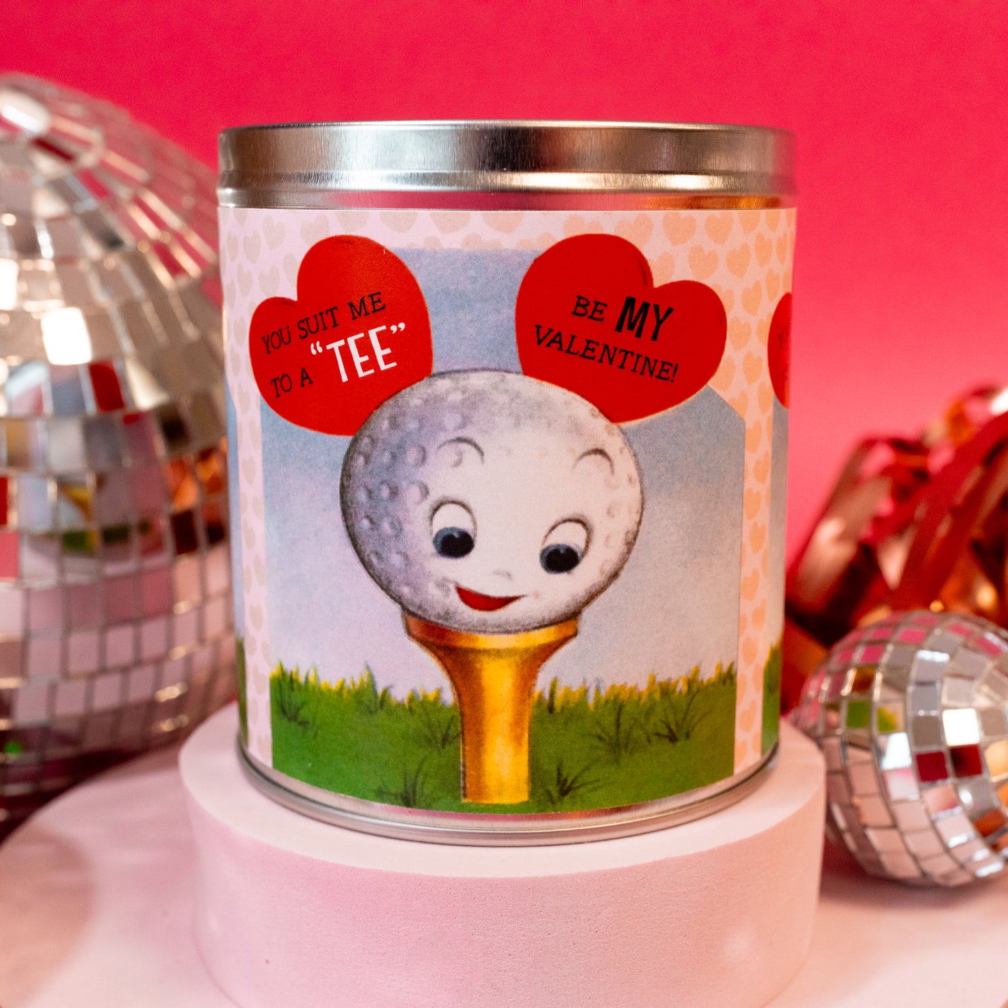 jar candle with golf ball and tee