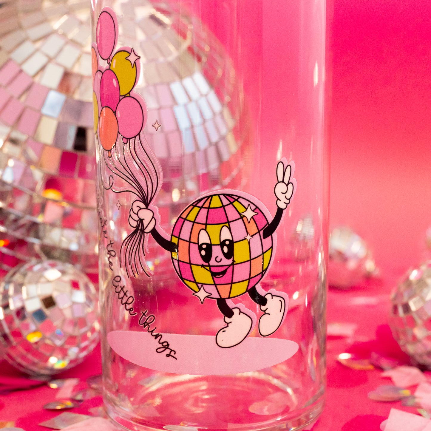 pink, yelllow and orange disco ball cartoon figure