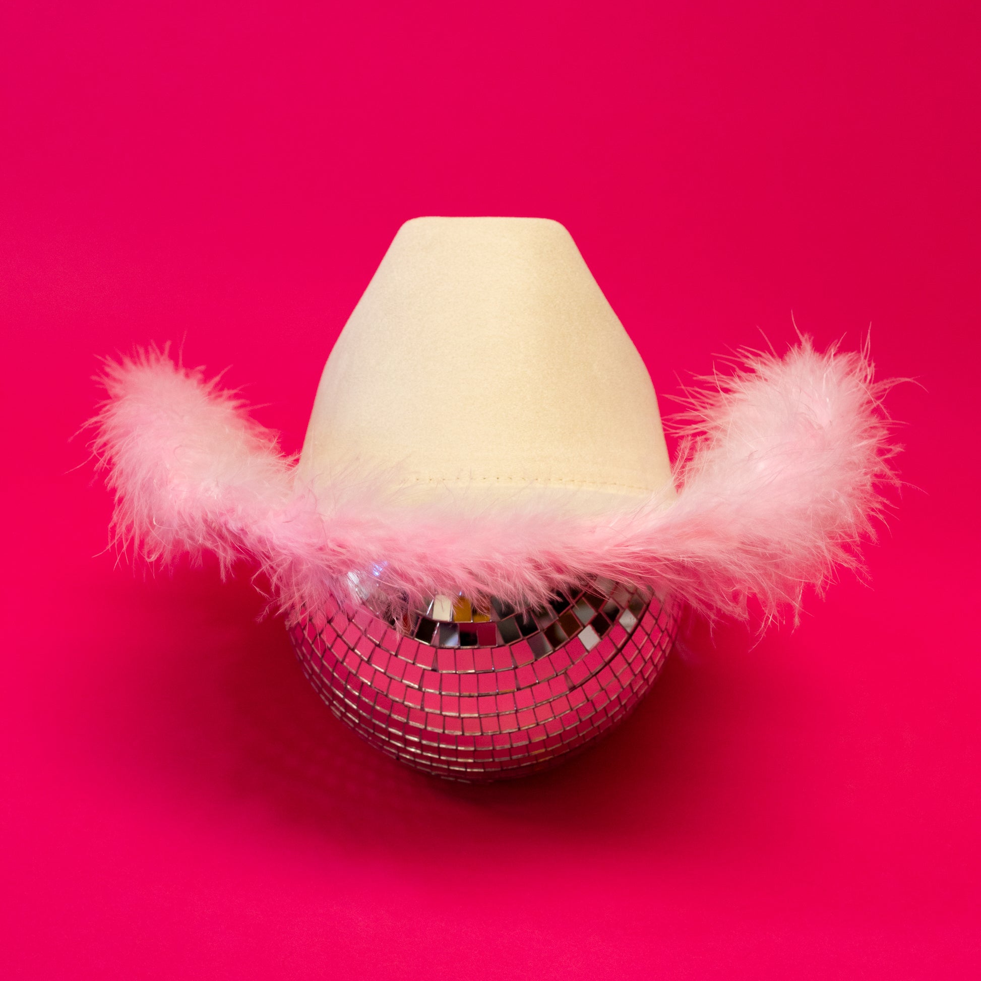 ivory cowboy hat with pink feathers