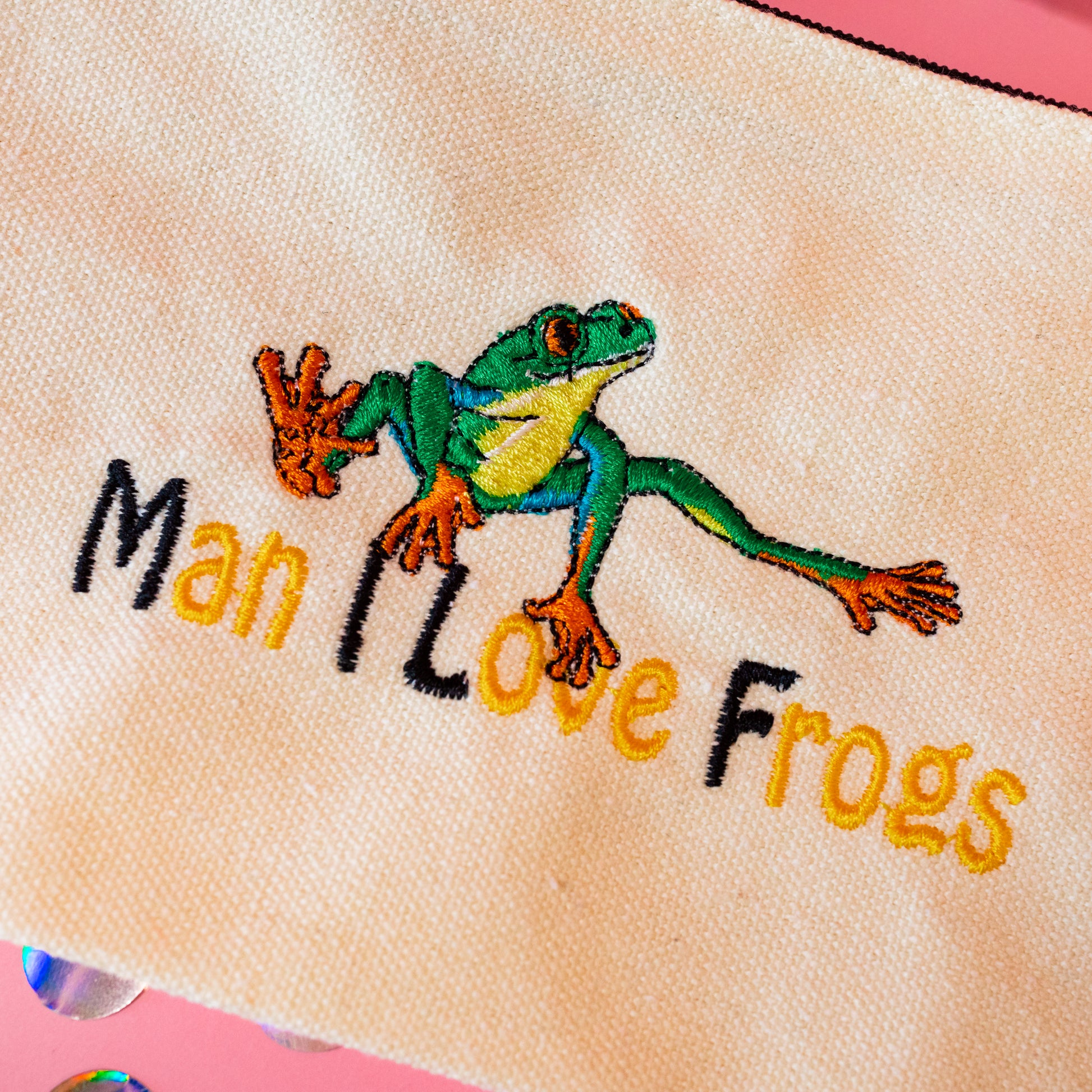yellow and black embroidered frogs pouch