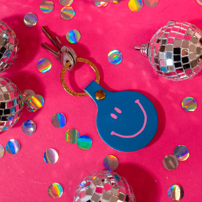 pink and blue smiley face keychain