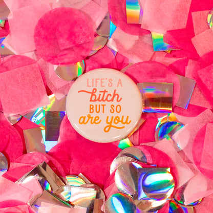 biege magnet with colorful words